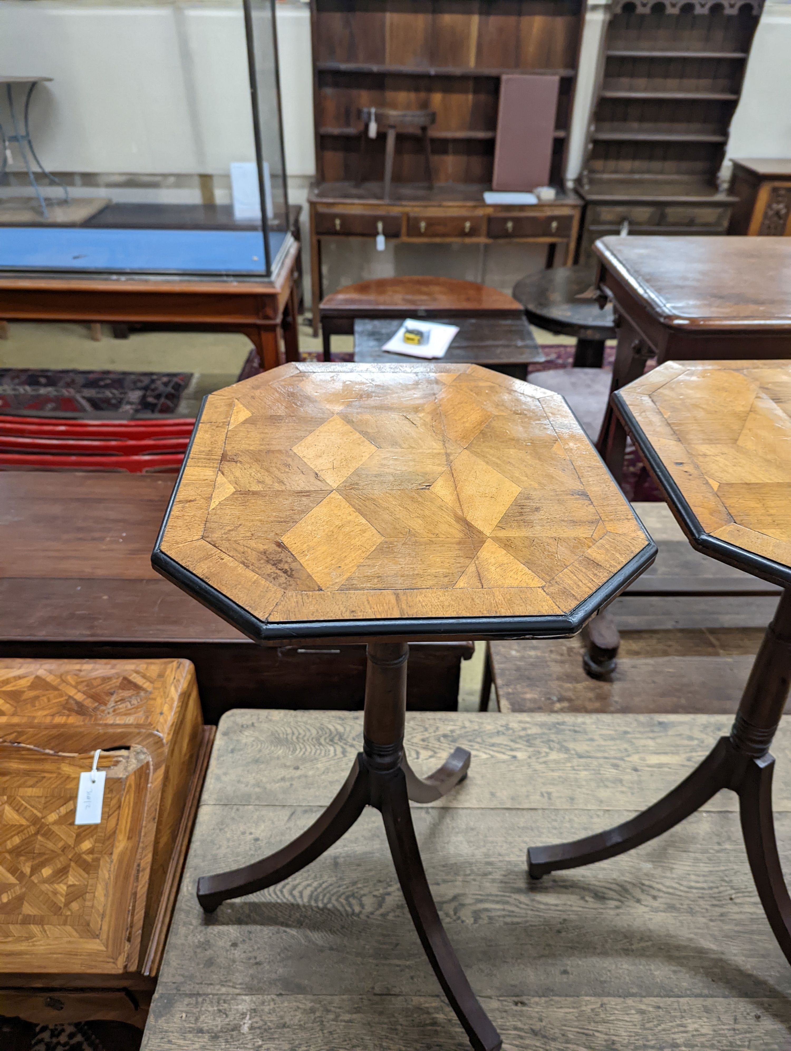 A pair of Regency style tripod tables, with walnut parquetry tops, W-38cm, D-44cm, H-71cm.
